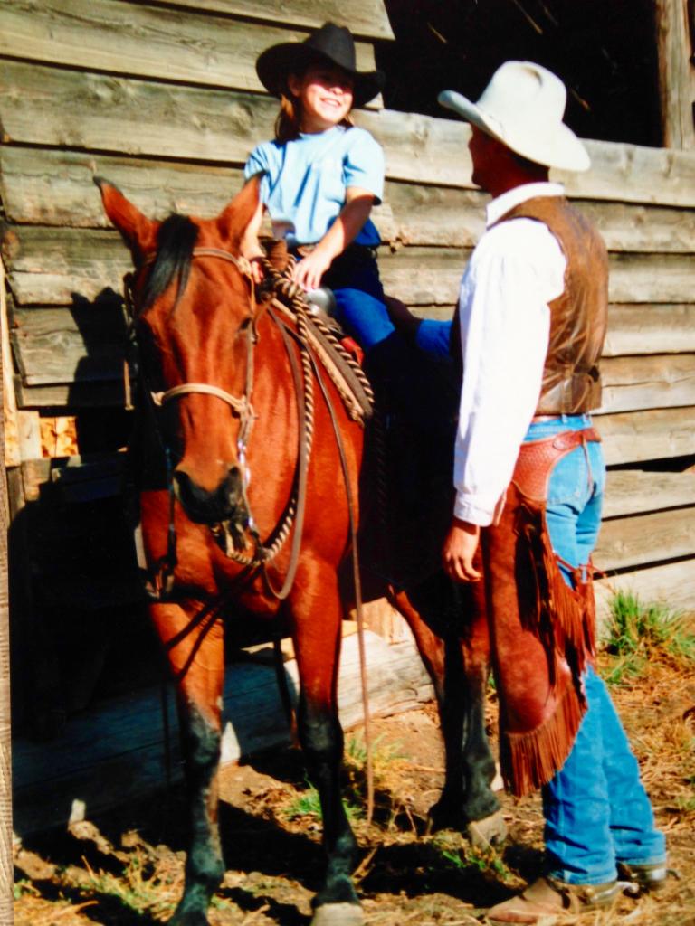Kassie and her cousin Brent on the horse known as her babysitter. (Courtesy of Kassie Guglielmino)